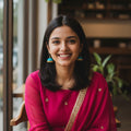 Model wearing terracotta jhumki earrings - yellow kurta