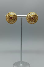 A pair of Antique Copper Filigree Floral Jali stud earrings with intricate cut-out patterns, displayed on a plain background.