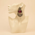 A pair of silver-toned traditional Indian chandelier earrings with rectangular pink gemstones and white pearl bead fringe, displayed on a white card labeled 'Fashion Jewellery'.