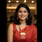 Woman wearing handpainted red and orange terracotta drop earrings with a red saree